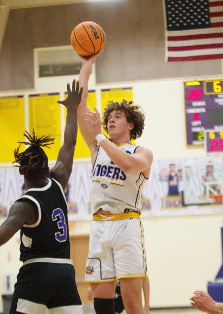 Lemoore High School boys' hoops team continues winning ways with hard fought 72-68 win over visiting Mission Oak in Wednesday night game Lemoore's Dom Fox goes for two against Mission Oak Wednesday night in Lemoore.